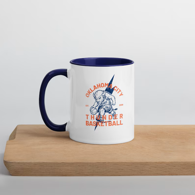 White mug with navy handle and Oklahoma City Thunder Basketball bison artwork